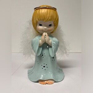 Porcelain angel with fiber optic wings